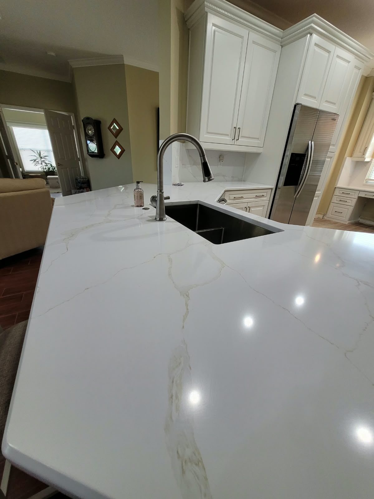 Luxury kitchen remodel with waterfall island