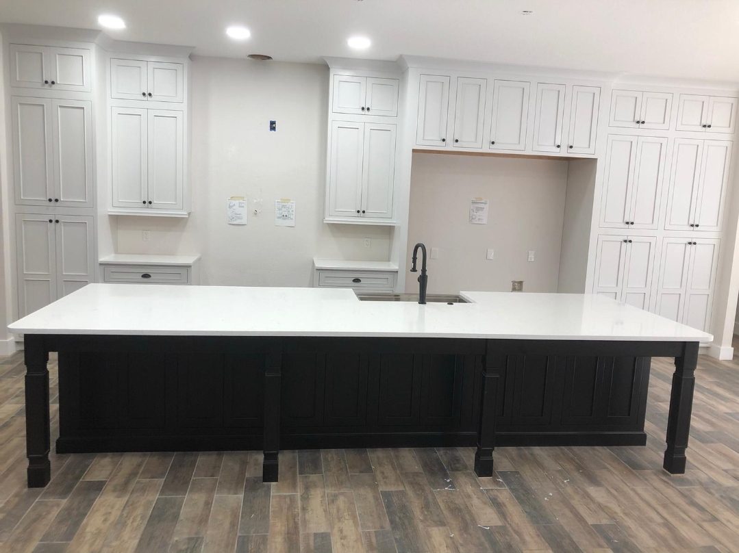 White kitchen with dark island